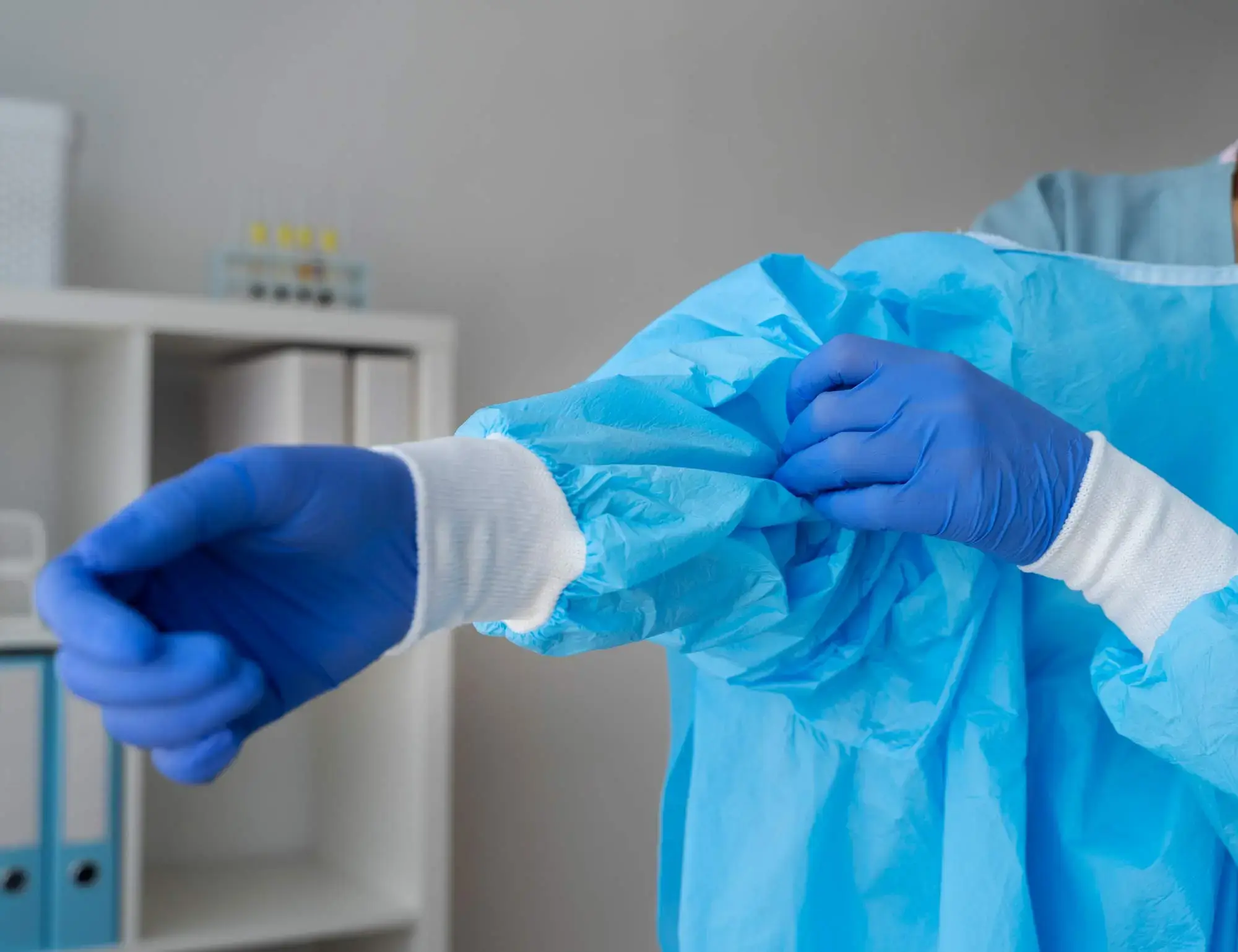 side-view-doctor-putting-medical-gown-1 side-view-doctor-putting-medical-gown-1